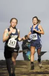 Palmer's Ellen Jorgenson closes in on a Soldotna Runner during
Saturday's cross country championships at Palmer High School.
(ROBERT DeBERRY/Frontiersman) Robert DeBerry