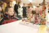 ROBERT DeBERRY/Frontiersman Nickolas Stevens, 4, gets a close
look at a gingerbread princess castle Saturday at the Dorothy G.
Page Museum in Wasilla.