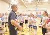 ROBERT DeBERRY/Frontiersman USA Volleyball coach John Kessel
talks with participants of the Northern Lights Volleyball Club
Volleyball Camp Monday morning at Palmer Junior Middle School.