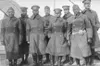 Officers of the 370th (Old 8th Illinois) on the deck of the La France IV before landing in New York City. Reading L to R: 2nd Lt. Lawson Price; 2nd Lt. L. W. Stearls; 2nd Lt. Ed. White; 2nd L