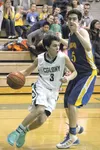 Colony guard Anton Chamblee drives the baseline during a loss to Kodiak Friday. JEREMIAH BARTZ/Frontiersman