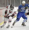 Kenai’s Landon Cialek and Palmer’s Joseph Samaniego battle for the puck Friday, Jan. 21, 2022, at the Kenai Multi-Purpose Facility in Kenai, Alaska. eff Helminiak/Peninsula Clarion
