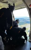 Members of the US Army Golden Knights Parachute Team watch to see what the winds do from 2000 feet as the aircraft ascends. "We can see where it’s traveling and how far, and it gives us a goo
