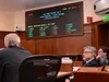 Members of the Alaska Senate watch the tally board for the vote on the state's draft operating budget, Wednesday, May 7, 2025. James Brooks/Alaska Beacon