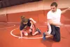 Wasilla wrestling coach Brian Cook works with Wasiila wrestlers
Raynie Hamlin and Brandon Abbott during practice Monday afternoon.
(ROBERT DeBERRY/Frontiersman)