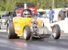 Brian Aszmus gets the front tires off the ground as he rockets
off the starting line Saturday afternoon at the Alaska Raceway Park
in the Butte. Racing at the state’s lone drag strip continue