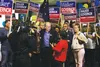 Bill Walker, who is running as an independent candidate for governor, leads a crowd of chanting supporters into Election Central early Tuesday night. After Tuesday’s primary, Walker’s general