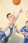ROBERT DeBERRY/Frontiersman Colony senior Chris Scott reaches
for the rebound during Palmer’s 50-46 win over the Knights at
Colony High School on Tuesday. Scott scored a game-high 18 in the
l
