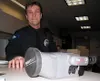 Wasilla Police Officer Tim Jessen shows the department's thermal
imager, which has resulted in several arrests by detecting clues
that otherwise might be missed. Photo by STEVE
KADEL/Frontier