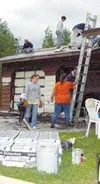 Photo by CASEY RESSLER/Frontiersman A crew of World Changers
students work on shingling a roof.