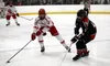 Wasilla's Michael Thompson tries to work the puck around Houston's Coleman Fimpel. Bruce Eggleston/matsusports.net