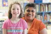 Pioneer Peak Elementary third-grader Breezley Snow poses for a photo with paraprofessional Kayla Hopkins at the school Feb. 27. The two are working together to raise money to send to an orpha