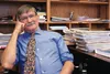 Dr. David Werner smiles in his office at Valley Medical Center amidst one of the last sets of all-paper medical records. After 40 years, Werner has retired and is closing down the practice th