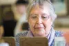 ROBERT DeBERRY/Frontiersman Jean Chapman scans her bingo
cards.