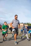 Race participants Darren Black, and his son Gabe Black run with the pack at the start of the Excel Coach’s Cup. Gabe Black went on to win the boy’s 10 and under division with a time of 24:03 