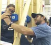 An Academy for Construction Trades student learns about
electrical wiring with the help of an instructor, who is learning
new teaching techniques. Photo by JEN RANSOM/Frontiersman.