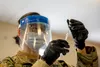 U.S. Army Spc. Ying Chen, assigned to Joint Task Force COVID-19, New York National Guard, prepares a dosage of the Pfizer-BioNTech COVID-19 vaccine at the Camp Smith Training Site Medical Rea