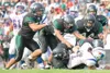 ROBERT DeBERRY/Frontiersman The Colony Knight defensive front
stops a North Pole drive for a first down during the second half of
the Knights’ win over the Patriots at the beginning of the
se