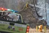 A state Division of Forestry firefighter works to douse a small wildfire along Bogard Road Thursday afternoon. CHRIS FORD/Frontiersman