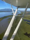 The Susitna River near its mouth at Cook Inlet, some 17 miles west of Anchorage. The peaks of the Alaska Range loom in the background.  Nathaniel Herz/Northern Journal
