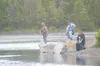 Anglers wait patiently for king salmon to show up at the Eklutna
Tailrace near Butte. Though the catching has been slow at the
tailrace, anglers still flocked to the fishing hole Monday. The
