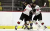 Houston's Hayden Chivers and Riley Scott collide as they force a Tri Valley player off the puck during a 12-0 win. Courtesy of Bruce Eggleston/matsusports.net