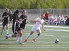 Wasilla senior Alexa Starr drives the ball alway from a crowd of Nikiski players during an 8-0 win over the Bulldogs in the Northern Lights Conference Championships last week. Starr was named