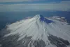 Augustine Volcano, which rises out of southern Cook Inlet, is seen from the air on March 7, 2023. The Alaska Division of Oil and Gas has taken steps to prepare for a geothermal lease sale for