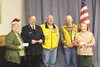 Mari Jo Parks of Mat-Su Special Santa, Jeff Josephson of the Salvation Army, Lions Bob Morigeau and Monty Hotchkiss, and Janet Jacobs of the Palmer Food Bank pose for a photo during the Palme