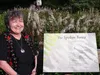 Alaska poet Ernestine Hayes stands proudly by her poem, “The Spoken Forest” installed in Totem Bight State Historical Park. Submitted by Wendy Erd