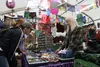 Tina Baugher attends to a customer inside the Mermaid Imports and Design tent Thursday, Aug. 26. Jacob Mann/Frontiersman