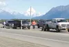 A worn joint on the inbound lanes of the Parks Highway overpass at Seward Meridian Parkway popped loose and disabled several vehicles Thursday. Here, three vehicles are stopped between the ov