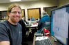 Jim DePasquale sits next to his computer at the Mat-Su Borough Emergency Operations Center. DePasquale uses sophisticated maps to help responders decide how many resources to send to each tro