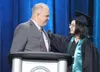 Valley Pathways principal Will Reeder congratulates graduating senior Braedon Noller. Jeremiah Bartz/Frontiersman