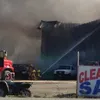 A fire near mile 51 of the Parks Highway caused officials to briefly close the Parks Highway on Friday. No injuries were reported in the blaze at Motor Rage of Alaska. Photo by Christina Sein