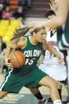 ROBERT DeBERRY/Frontiersman Colony junior Kate Klapperich drives
toward the basket during Monday’s first round of state championship
play against the Wasilla Warriors.