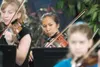 ROBERT DeBERRY/Frontiersman Lene Kennison plays with the
Matanuska-Susitna Orchestra on Saturday during the 2010 String
Jamboree at First Baptist Church in Palmer.