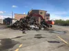 A cleanup crew clears out the Jenski Automotive lot after a fire destroyed the building in February. Photo courtesy of the Jenski family.