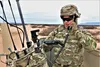 Staff Sgt. Micah Sheean, an electronic warfare specialist, communicates from atop a high mobility multipurpose wheeled vehicle. Army senior leaders discussed readiness and modernization prior