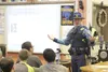 Alaska State Trooper Nick Nigro talks to eighth-grade students about cyberbullying and online safety in the Colony Middle School library on Friday, Oct. 9. Colony guidance counselor Angie Bur