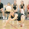 ROBERT DeBERRY/Frontiersman Houston's Kelsey Thamm stretches to
make a dig during the second game against Lathrop Thursday night at
Houston High School.