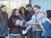 Colony Middle School teacher Kevin Zagyva embraces his wife Sharon and some students as they join him in song at his home on Friday, Nov. 11. Zagyva was re-diagnosed with cancer this spring a