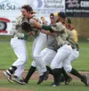 Mat-Su Miners infielder Tyler Bosetti celebrates with teammates after his walk-off single that gave the Miners a 2-1 win over the Anchorage Bucs Thursday in Palmer. JEREMIAH BARTZ/ Frontiersm