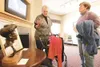 ROBERT DeBERRY/Frontiersman Artist Sheila M. Howard talks about
her bronze sculpture, 'Amanda,' with Ellen Gantly at the Primrose
Retirement Community'€™s 'Art From The Young At Heart' Second