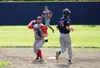 Kenai's Matthew Daugherty gets out of the way of the throw as Wasilla shortstop Matt Palmer turns the double play during Wasilla's 5-4 loss to Kenai Thursday, July 21, 2016, at McManus Field 