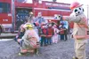 Colleen Rice helps preschool student Tyler Holst use the fire
hose to spray water Oct. 20. Sparky the Fire Dog directs as Steven
Sampson, Blayze Gotthardt, Gage Hawes, Lily Pacheco and Joe Ha