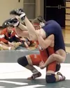 Jed Wade scores one of his Alaska state record 144 wins over
Palmer's Colby Yuill in the Valley Tri-Meet last season.
Frontiersman file photo.