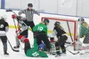 An MTA player takes a tumble amidst the chaos of others attacking and defending the goal during the second day of the C-Cup Hockey tournament at the MTA Events Center in Palmer. The Kenai Riv