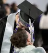 Jasper Esteban kisses a loved one on the forehead during the rose ceremony at the Burchell High School graduation Friday, May 17, 2024, at the Menard Arena in Wasilla. Jeremiah Bartz/Frontier
