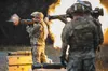 Army 1st Lt. Gerard Holodak, assigned to the 109th Transportation Company, 17th Combat Sustainment Support Battalion, U.S. Army Alaska, fires the M136E1 AT4-CS confined space light anti-armor